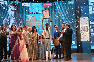 Saurabh Jain raising his world record certificate after 30 hours non-stop